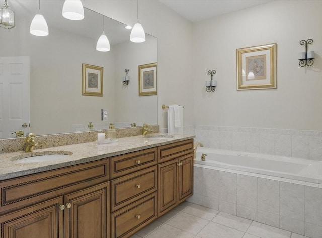 bathroom with a sink, tile patterned flooring, double vanity, and a garden tub