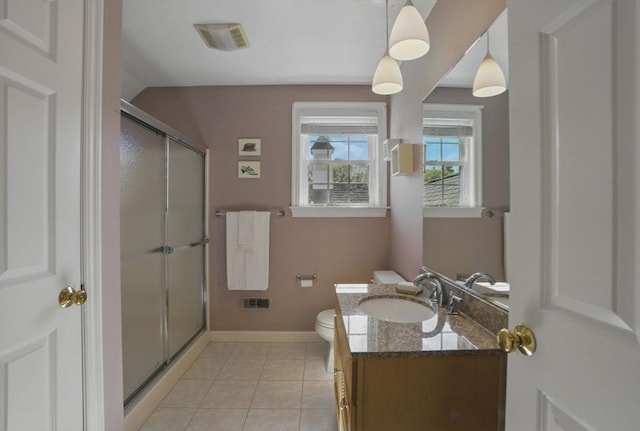 full bath with toilet, a stall shower, visible vents, baseboards, and vanity
