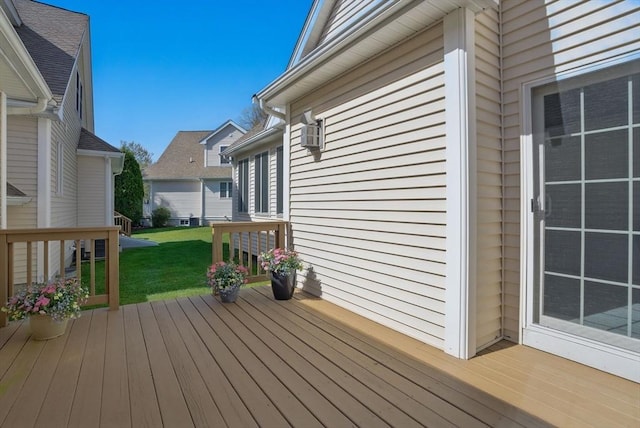 wooden terrace featuring a yard
