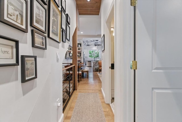 corridor with light wood-style flooring and recessed lighting