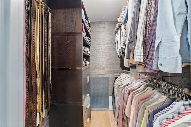 spacious closet with wood finished floors