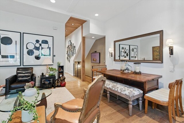 dining room featuring light wood-type flooring, stairway, recessed lighting, and baseboards