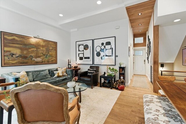 living room with light wood-style flooring, recessed lighting, and baseboards