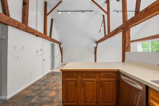 kitchen with dishwasher, lofted ceiling, baseboards, light countertops, and baseboard heating