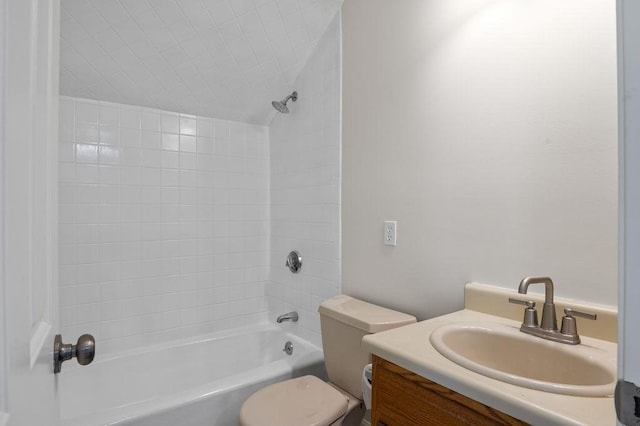 bathroom with tub / shower combination, toilet, and vanity