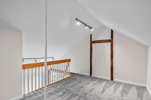 bonus room with lofted ceiling, carpet floors, and baseboards
