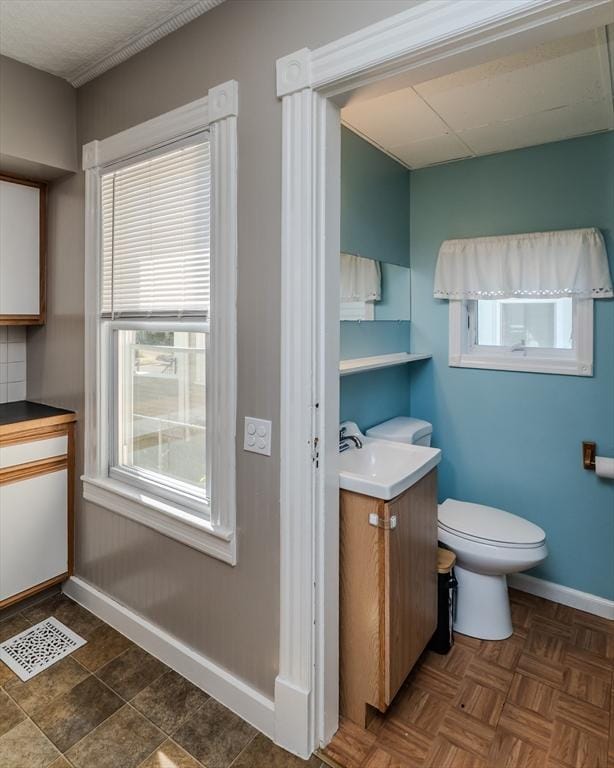 50 Duryea St, Springfield, MA 01104 - bathroom featuring vanity, baseboards, and toilet