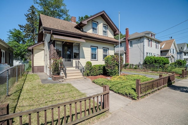 50 Duryea St, Springfield, MA 01104 - view of front facade featuring a shingled roof and a chimney