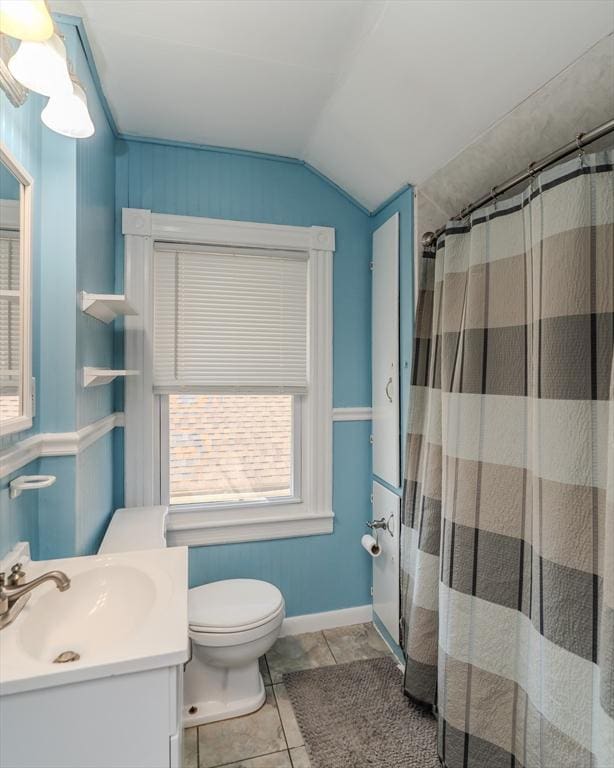 50 Duryea St, Springfield, MA 01104 - bathroom featuring lofted ceiling, curtained shower, toilet, vanity, and tile patterned floors