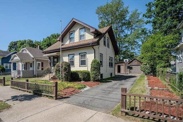 50 Duryea St, Springfield, MA 01104 - bungalow featuring an outbuilding, a garage, and roof with shingles