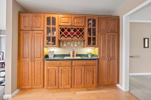 49 Edgewater Way, Wareham, MA 02571 - bar featuring light wood-style flooring, wet bar, and baseboards