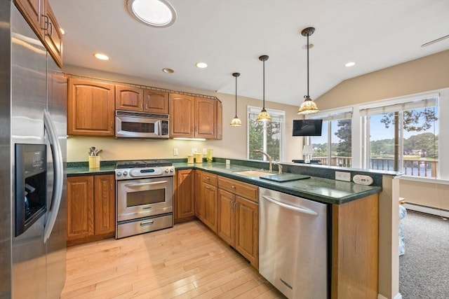 49 Edgewater Way, Wareham, MA 02571 - kitchen with a sink, a peninsula, brown cabinets, and stainless steel appliances