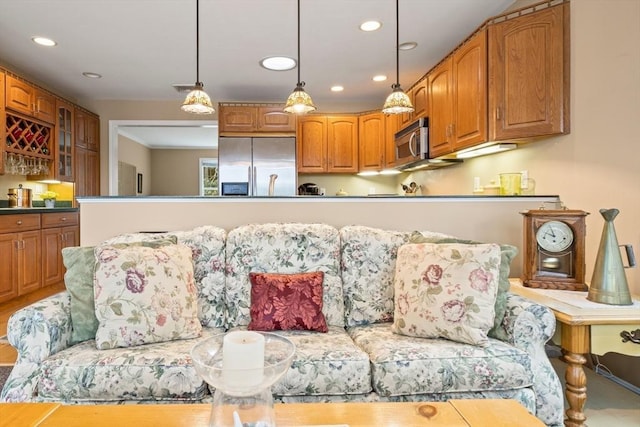 49 Edgewater Way, Wareham, MA 02571 - kitchen with brown cabinetry, pendant lighting, glass insert cabinets, and stainless steel appliances
