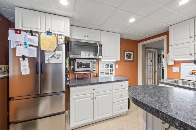 49 Edgewater Way, Wareham, MA 02571 - kitchen featuring a sink, dark countertops, recessed lighting, appliances with stainless steel finishes, and white cabinets