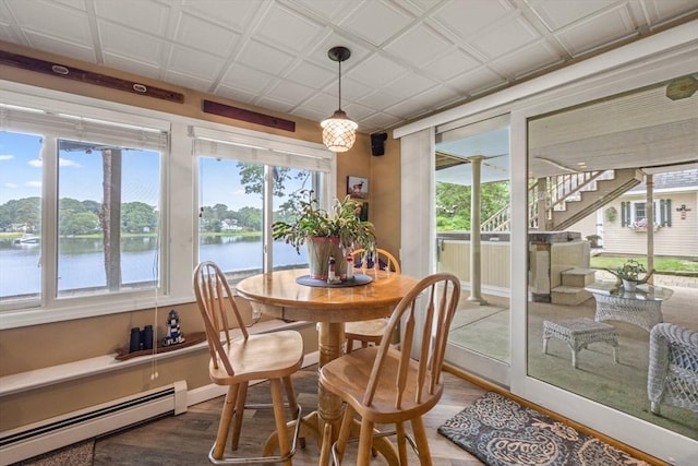 49 Edgewater Way, Wareham, MA 02571 - dining room with an ornate ceiling, baseboard heating, wood finished floors, and a water view