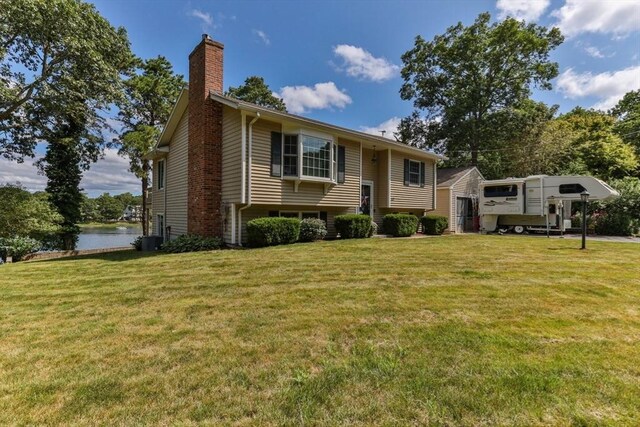 49 Edgewater Way, Wareham, MA 02571 - split foyer home featuring a front lawn, a water view, and a chimney