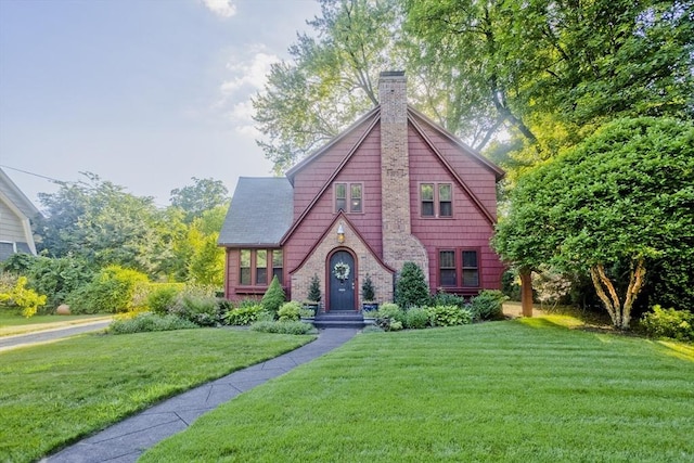 1142 Longmeadow St, Longmeadow, MA 01106 - tudor house featuring a front lawn and a chimney