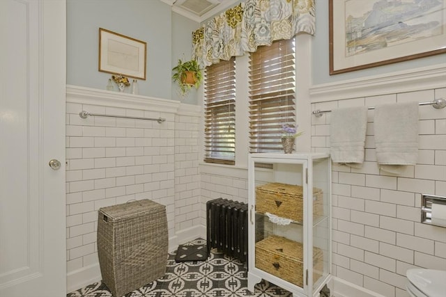 1142 Longmeadow St, Longmeadow, MA 01106 - bathroom featuring radiator heating unit, tile walls, wainscoting, and ornamental molding