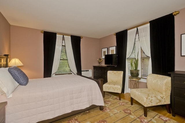1142 Longmeadow St, Longmeadow, MA 01106 - bedroom featuring wood finished floors and an AC wall unit