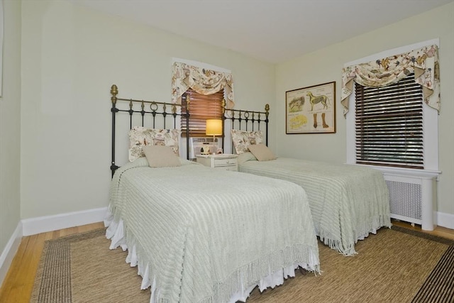 1142 Longmeadow St, Longmeadow, MA 01106 - bedroom with wood finished floors and radiator heating unit