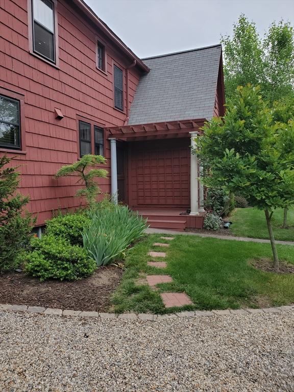 1142 Longmeadow St, Longmeadow, MA 01106 - view of side of home featuring roof with shingles and a lawn