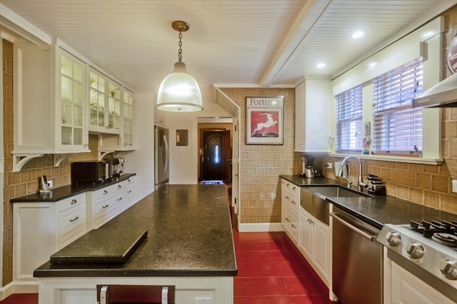 1142 Longmeadow St, Longmeadow, MA 01106 - kitchen featuring appliances with stainless steel finishes, a center island, exhaust hood, glass insert cabinets, and tasteful backsplash