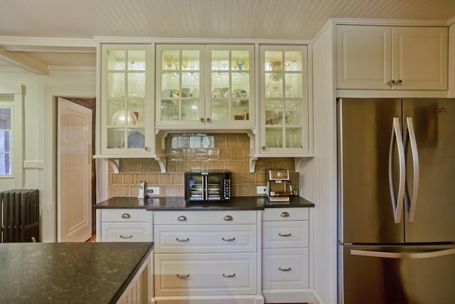 1142 Longmeadow St, Longmeadow, MA 01106 - kitchen with freestanding refrigerator, radiator heating unit, glass insert cabinets, and backsplash