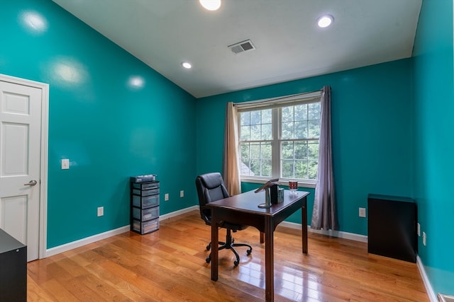 office area with lofted ceiling and light hardwood / wood-style flooring