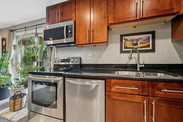 41 Dick Dr, Worcester, MA 01609 - kitchen with appliances with stainless steel finishes, a sink, and dark stone countertops