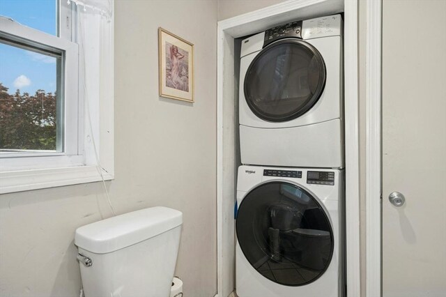 41 Dick Dr, Worcester, MA 01609 - laundry area with stacked washing machine and dryer and healthy amount of natural light