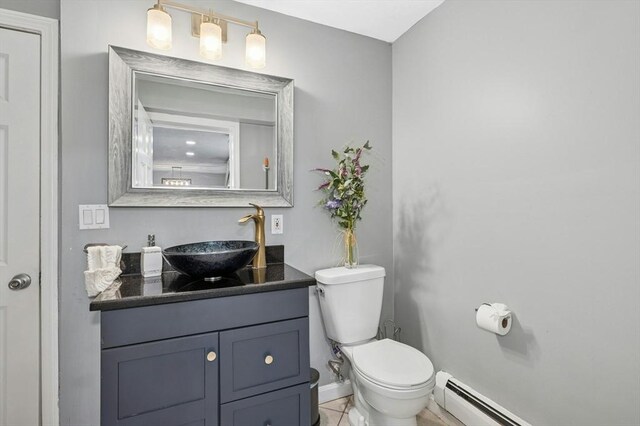 41 Dick Dr, Worcester, MA 01609 - bathroom featuring vanity, a baseboard radiator, toilet, and baseboards