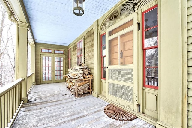 unfurnished sunroom with french doors