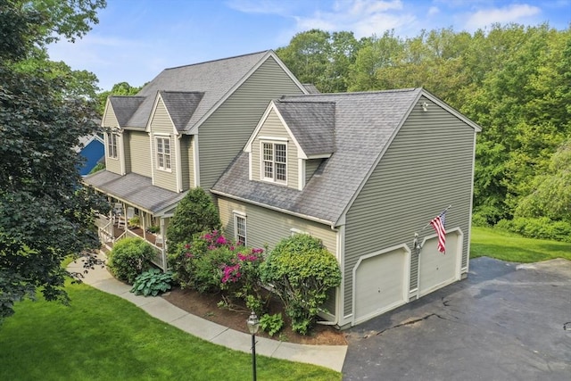 17 Sean Mikeal Way, Grafton, MA 01519 - view of front of property with an attached garage, roof with shingles, driveway, and a front lawn