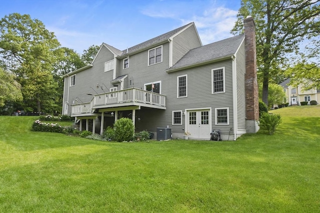 17 Sean Mikeal Way, Grafton, MA 01519 - back of house featuring a chimney, central AC unit, a lawn, and a wooden deck