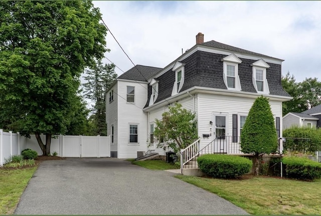 19 Center St, Weymouth, MA 02189 - view of front of house with roof with shingles, a chimney, asphalt driveway, mansard roof, and a gate