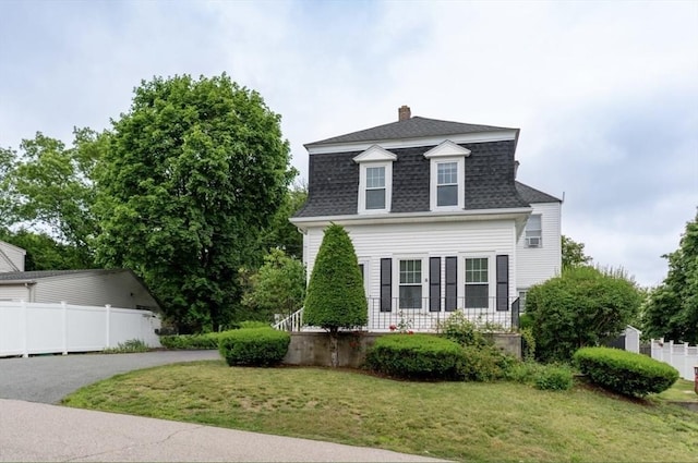 19 Center St, Weymouth, MA 02189 - view of front of home featuring roof with shingles and a chimney
