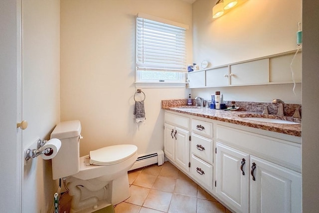 19 Center St, Weymouth, MA 02189 - full bath featuring a baseboard heating unit, tile patterned flooring, and double vanity