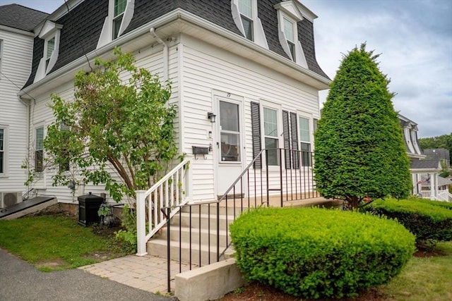 19 Center St, Weymouth, MA 02189 - view of exterior entry featuring roof with shingles and mansard roof