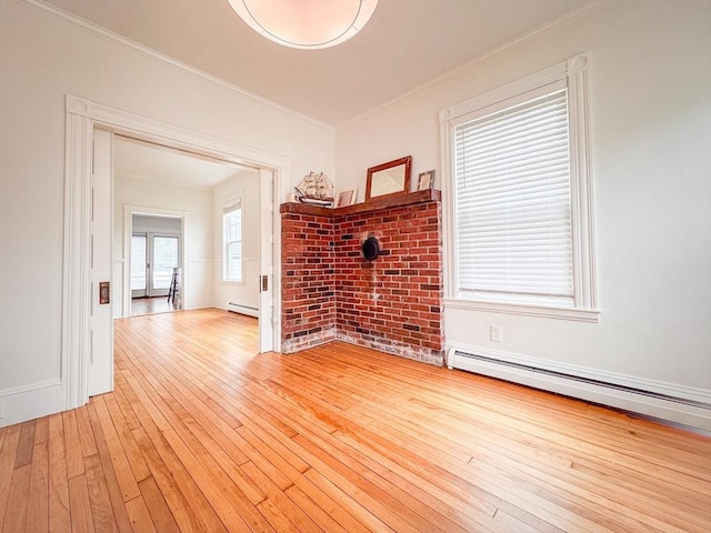 19 Center St, Weymouth, MA 02189 - unfurnished living room with crown molding, light wood-style flooring, and a baseboard heating unit