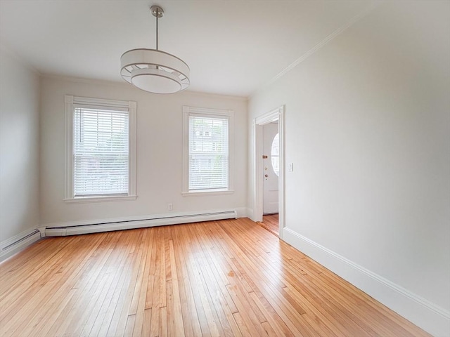 19 Center St, Weymouth, MA 02189 - unfurnished room featuring a baseboard heating unit, light wood finished floors, and crown molding