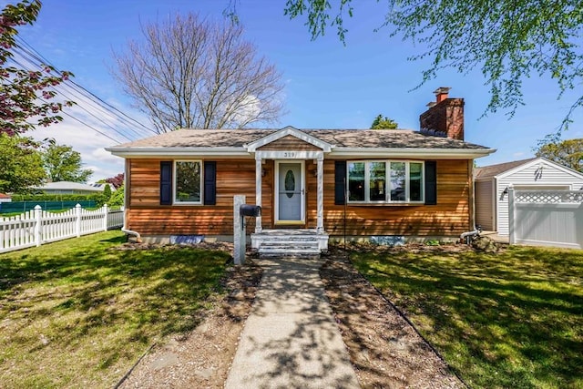 329 Brooklawn Ave, New Bedford, MA 02745 - ranch-style house featuring a chimney and a garage