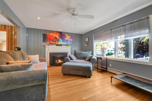329 Brooklawn Ave, New Bedford, MA 02745 - living room with ceiling fan, light wood-style flooring, a brick fireplace, and recessed lighting