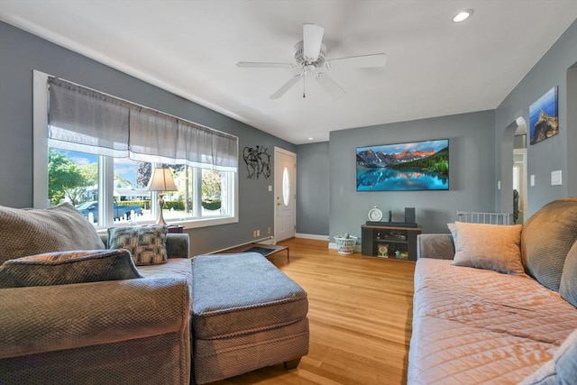 329 Brooklawn Ave, New Bedford, MA 02745 - living area featuring light wood finished floors, ceiling fan, baseboards, arched walkways, and recessed lighting