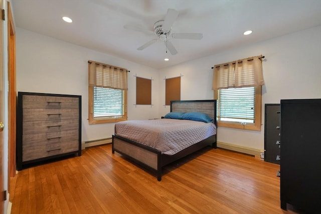 329 Brooklawn Ave, New Bedford, MA 02745 - bedroom with baseboard heating, wood finished floors, recessed lighting, a ceiling fan, and baseboards