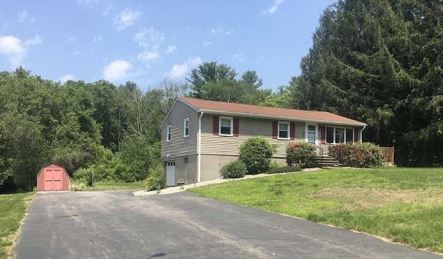46 Mill Rd, Dudley, MA 01571 - ranch-style home featuring a front lawn, a garage, and asphalt driveway