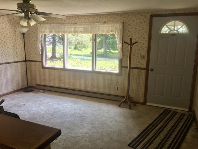46 Mill Rd, Dudley, MA 01571 - entrance foyer with wallpapered walls, a baseboard heating unit, carpet floors, and a ceiling fan