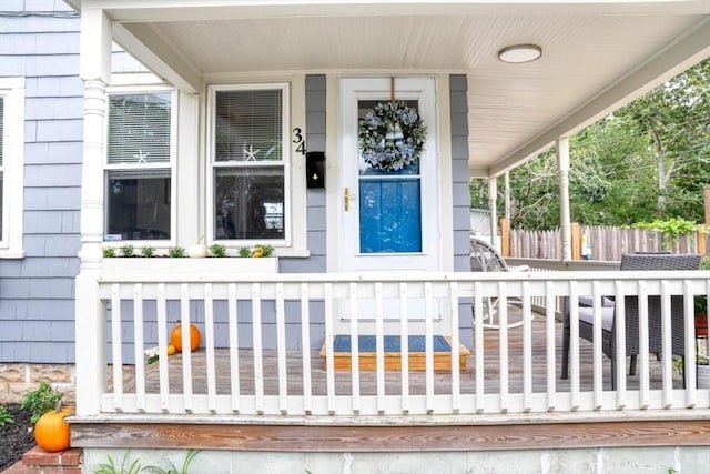 entrance to property featuring a porch