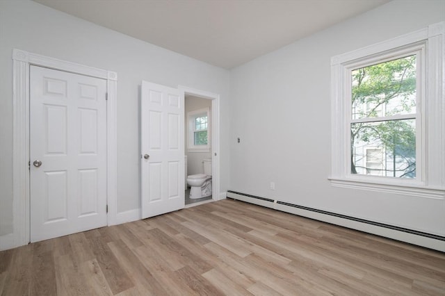 7 Cliff St, Attleboro, MA 02703 - unfurnished bedroom with a baseboard radiator, light wood-style floors, multiple windows, and ensuite bath