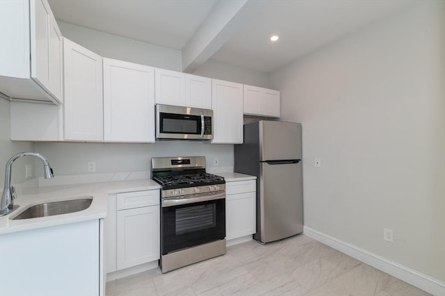 7 Cliff St, Attleboro, MA 02703 - kitchen with appliances with stainless steel finishes, beamed ceiling, white cabinetry, light countertops, and recessed lighting