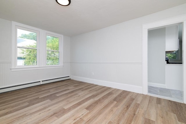 7 Cliff St, Attleboro, MA 02703 - empty room with light wood-style floors and a baseboard radiator